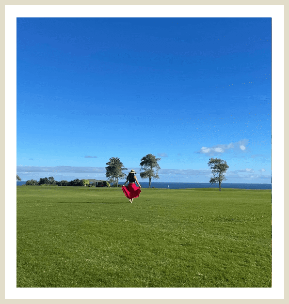 A person flying a kite in the middle of a field.