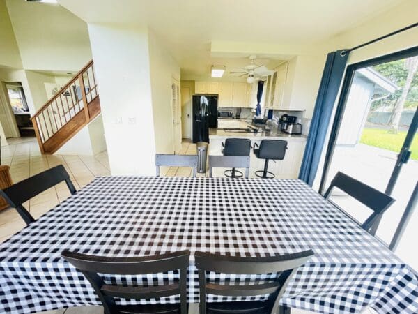 A table with black and white checkered tablecloth