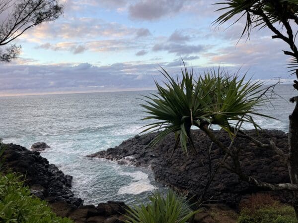 A view of the ocean from a rocky shore.