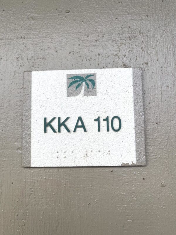 A sign on the side of a building that says " kka 1 1 0 ".