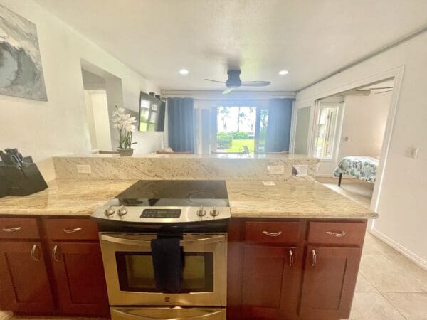 A kitchen with an oven and sink in it