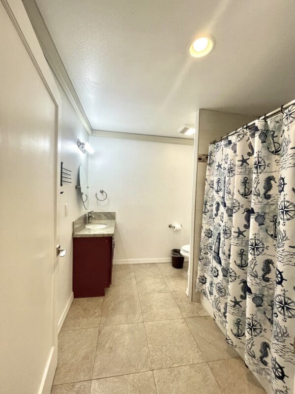 A bathroom with a sink and toilet in it