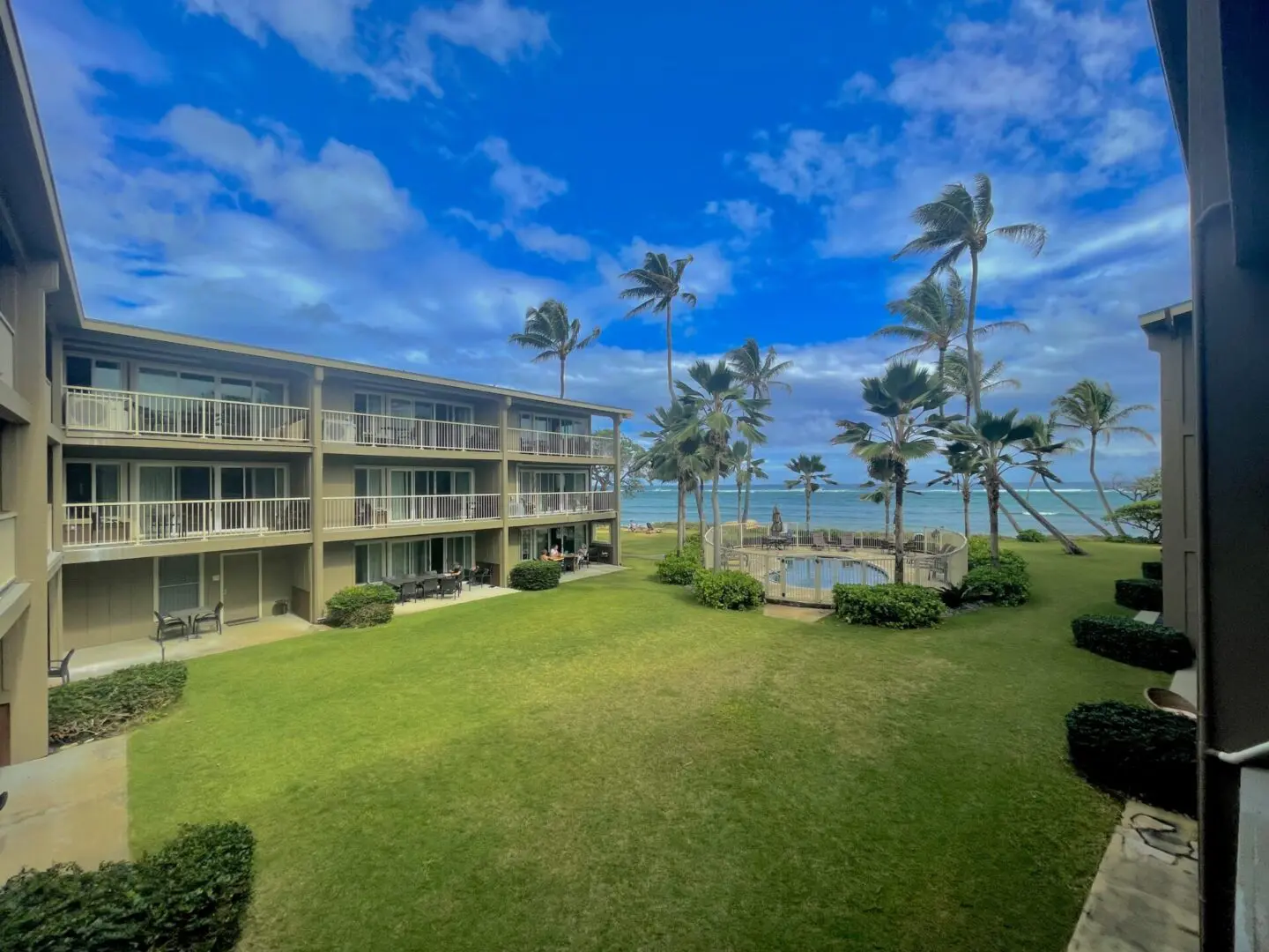 A view of the ocean from an apartment complex.