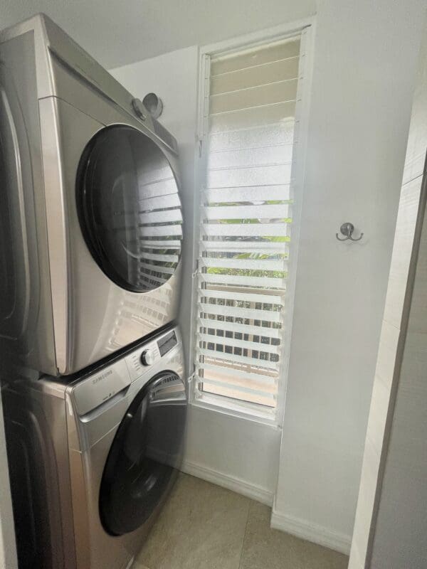 A white washer and dryer in a room.