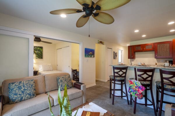 A living room with a couch and chairs in it