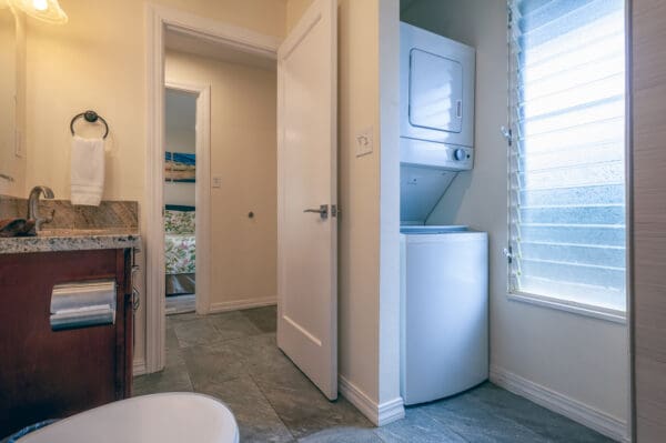 A white door and window in a room.