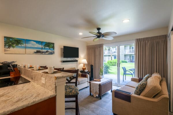 A living room with a couch, table and television.